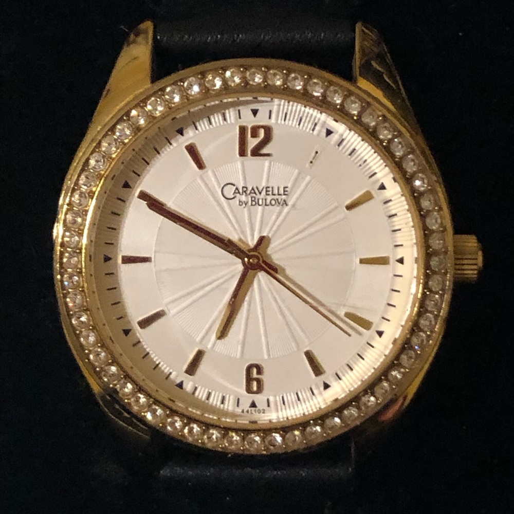 Caravelle by Bulova Womens White Dial Gold Leather  Strap Watch Paved C935172